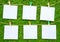 Solid color notes, isolated on artificial grass background