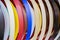 Solid color or wood grain PVC edge banding tape. ABS edge banding. Set of colored thermoplastic edges. Multicolored bobbins of PVC