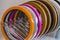 Solid color or wood grain PVC edge banding tape. ABS edge banding. Set of colored thermoplastic edges. Multicolored bobbins of PVC