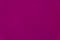 solid magenta textured stucco wall background close up