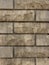 Solid piece of beige brick wall. brickwork for background or texture  dark spots on brickwork