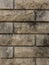 Solid piece of beige brick wall. brickwork for background or texture  dark spots on brickwork