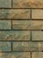 Solid piece of beige brick wall. brickwork for background or texture  dark spots on brickwork