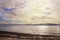 Solid square clouds over the sea, a storm on the horizon and sandy beach