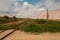 Soligork salt mine slagheap mountains and scenic beautiful nature with green grass and dramatic cloudy sky in hot summer