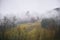 Solitaire mountain hut in wafts of mist, mystic landscape