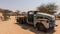 Solitaire station, between Sossusvlei and Walvis bay in Namibia, decorated with rusty and weathered car wrecks