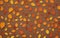 Solitary autumn leaves on a brown background