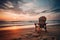 A solitary beach chair facing the ocean at sunrise, inviting relaxation and contemplation