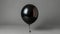 Solitary Black Balloon Floating in Isolation on a Cutout Background