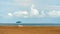 Solitary deck chair and umbrella on Jaco beach, in the Puntarenas province of Coata Rica