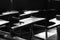 Solitary desks with no students in empty classroom in the dark Caracas Venezuela