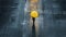 Solitary figure of a lonely woman with a yellow umbrella walking on a empty street