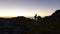 Solitary hiker camping in mountains above sea