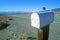 Solitary mailbox by side of highway, Sierras, CA