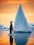 Solitary penguin standing on ice with the vast waters and an orange-hued sky in the background.