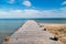 Solitary pier to the warm waters