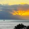 Solitary sailor at sunset off the Maui coast