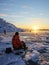 Solitary Serenity: Man Enjoying a Sunset in Antarctica