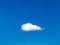 Solitary white cloud in blue sky