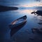 A solitary wooden boat on the calm surface of the lake under the tranquil blue hues of the twilight sky