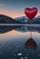 Solitude\\\'s Serenade: Red Heart Balloon Floating Above Frozen Waters