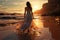 Solitude at sunrise, young woman in white dress strolls on beach