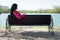 Solitude woman on bench in park