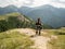 SOLKPASS, AUSTRIA - 08/13/2020: Woman biker with helmet looking at mountains