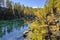 Solo Backpacker Trekking on the mountain in autumn trought foliage, lake, yellow, and orange colors