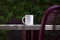 A solo blank white coffee mug on a table