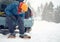 Solo indian man traveller camping through an evergreen winter forest in Canada