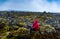 Solo male traveler on scenic lava field in Iceland