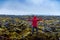 Solo male traveler on scenic lava field views in Iceland