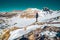 Solo man hiking on italian Alps mountain range Italy - Hiker walking during the end of winter - Concepts about travel  lifestyle