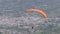 Solo Paraglide Flying Against Populated Area In Andes