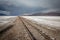 Solo railroad tracks crossing the Bolivian desert and altiplano region