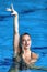 Solo synchronized swimming performance, blending grace and precision in aquatic artistry