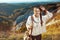 Solo tourist woman in front of scenery of summer Tuscany