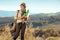 Solo traveller woman with Italian flag on summer Tuscany trip