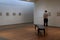 Solo visitor walking through room admiring beautiful artwork, Portland Art Museum,Maine,2016