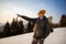 Solo young man traveller camping through an evergreen winter forest in Canada