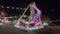Solobaru, Sukoharjo, Indonesia, December 23rd, 2023, illuminated pirate ship swing boat ride in the amusement recreation park