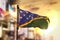 Solomon Islands Flag Against City Blurred Background At Sunrise