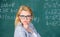 Solve mathematics task. Teacher woman think about solving and result. Lady wear eyeglasses smart teacher classroom