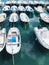 Some boat bright colors on background blue water lake of pier, fishing and boating on summer landscape, holiday travel and sun