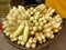 Some bundles of raw maize or corns on a basket