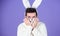 Some bunny loves you. Man wearing rabbit ears. Easter hare. Bearded man in easter rabbit costume. Happy Hipster dressed