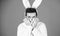 Some bunny loves you. Man wearing rabbit ears. Easter hare. Bearded man in easter rabbit costume. Happy Hipster dressed