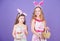 Some bunny loves you. Small girls in bunny headband for Easter celebration. Little girls wearing Easter bunny ears. Cute